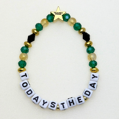 Broadway Stacks NEW MONEY Collection. 5 stretch bracelets included in Stack. Teal, black and gold colored beads. Letter beads that spell quotes. Gold star logo bead to remind you that you shine.