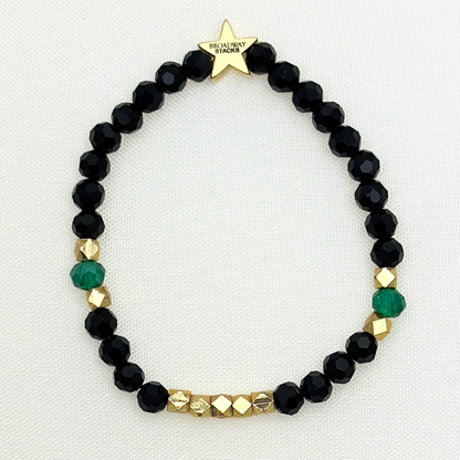 Broadway Stacks NEW MONEY Collection. 5 stretch bracelets included in Stack. Teal, black and gold colored beads. Letter beads that spell quotes. Gold star logo bead to remind you that you shine.