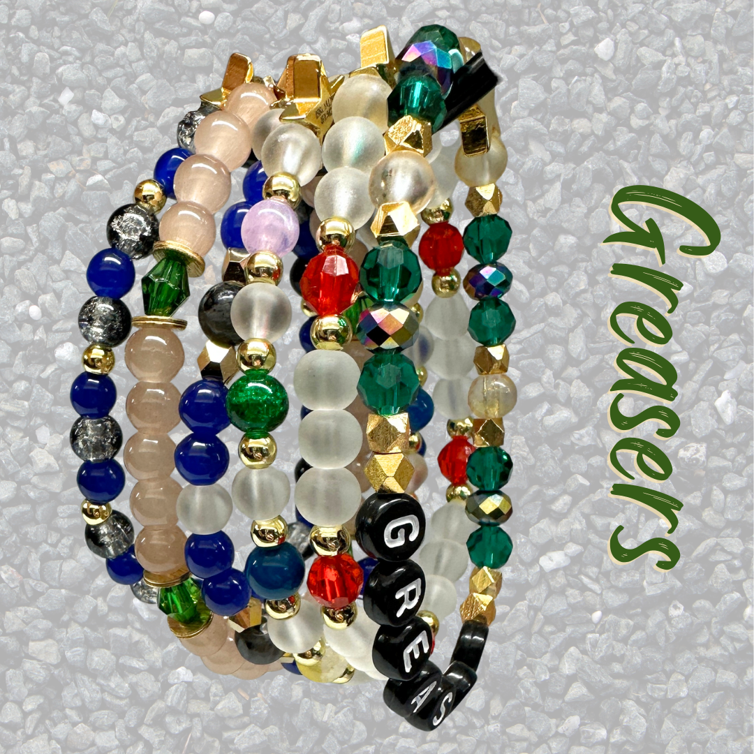 Broadway Stacks STAY GOLD collection. Stretch bracelets included in Stack. Inspired by characters from The Outsiders the Musical. Greasers and Socs. Broadway Stacks gold star logo bead to remind you that You Shine!