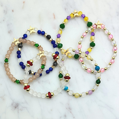 Broadway Stacks STAY GOLD collection. Stretch bracelets included in Stack. Inspired by characters from The Outsiders. Broadway Stacks gold star logo bead on back.