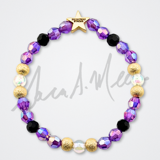 Broadway Stacks Special Edition Sara Mearns ROCKSTAR Bracelet Collection. 5 stretch bracelets included in Stack. Purple, clear, white, black and gold colored beads. Letter beads that spell quotes. Gold star logo bead to remind you that you shine. Sara Mearns and Ballet fans.