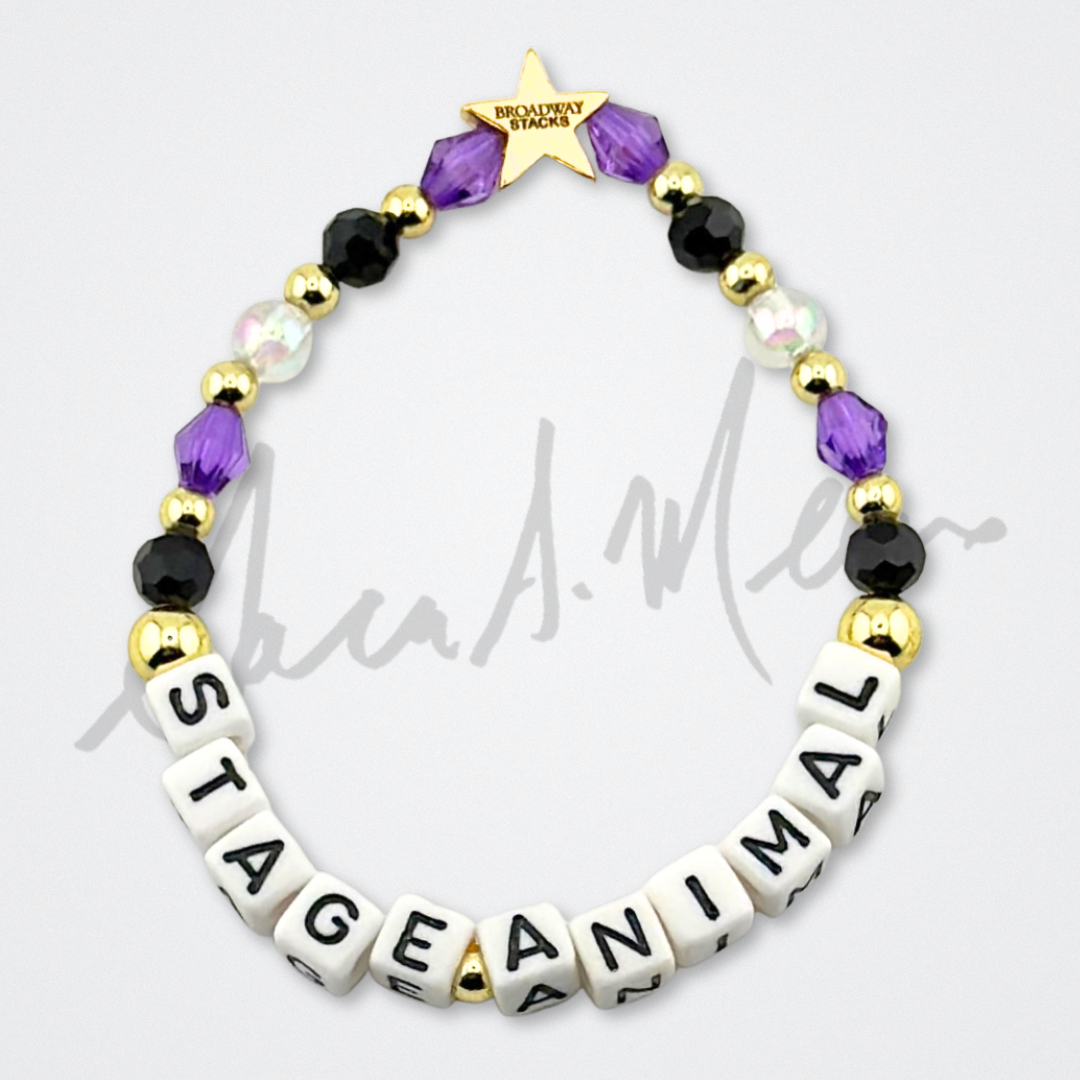 Broadway Stacks Special Edition Sara Mearns ROCKSTAR Bracelet Collection. 5 stretch bracelets included in Stack. Purple, clear, white, black and gold colored beads. Letter beads that spell quotes. Gold star logo bead to remind you that you shine. Sara Mearns and Ballet fans.