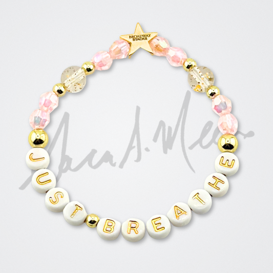 Broadway Stacks Special Edition Sara Mearns STAGE Bracelet Collection. 5 stretch bracelets included in Stack. Purple, pink, clear, white, glitter and gold colored beads. Letter beads that spell quotes. Gold star logo bead to remind you that you shine. Sara Mearns and Ballet fans.
