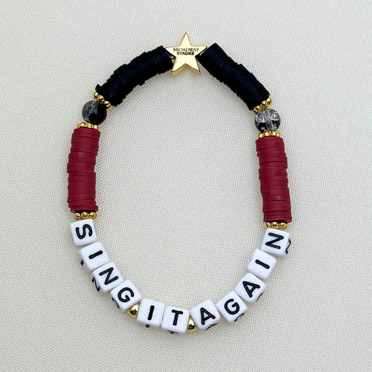 Broadway Stacks Underworld collection. 5 stretch bracelets included in Stack. Red, garnet, black and gold colored beads. Letter beads that spell quotes. Gold star logo bead to remind you that you shine.