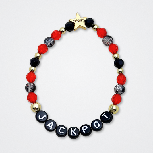 Broadway Stacks CLOSE-UP Collection. 6 stretch bracelets included in Stack. Red, black and gold colored beads. Letter beads that spell quotes. Gold star logo bead to remind you that you shine. Sunset Blvd fans. 