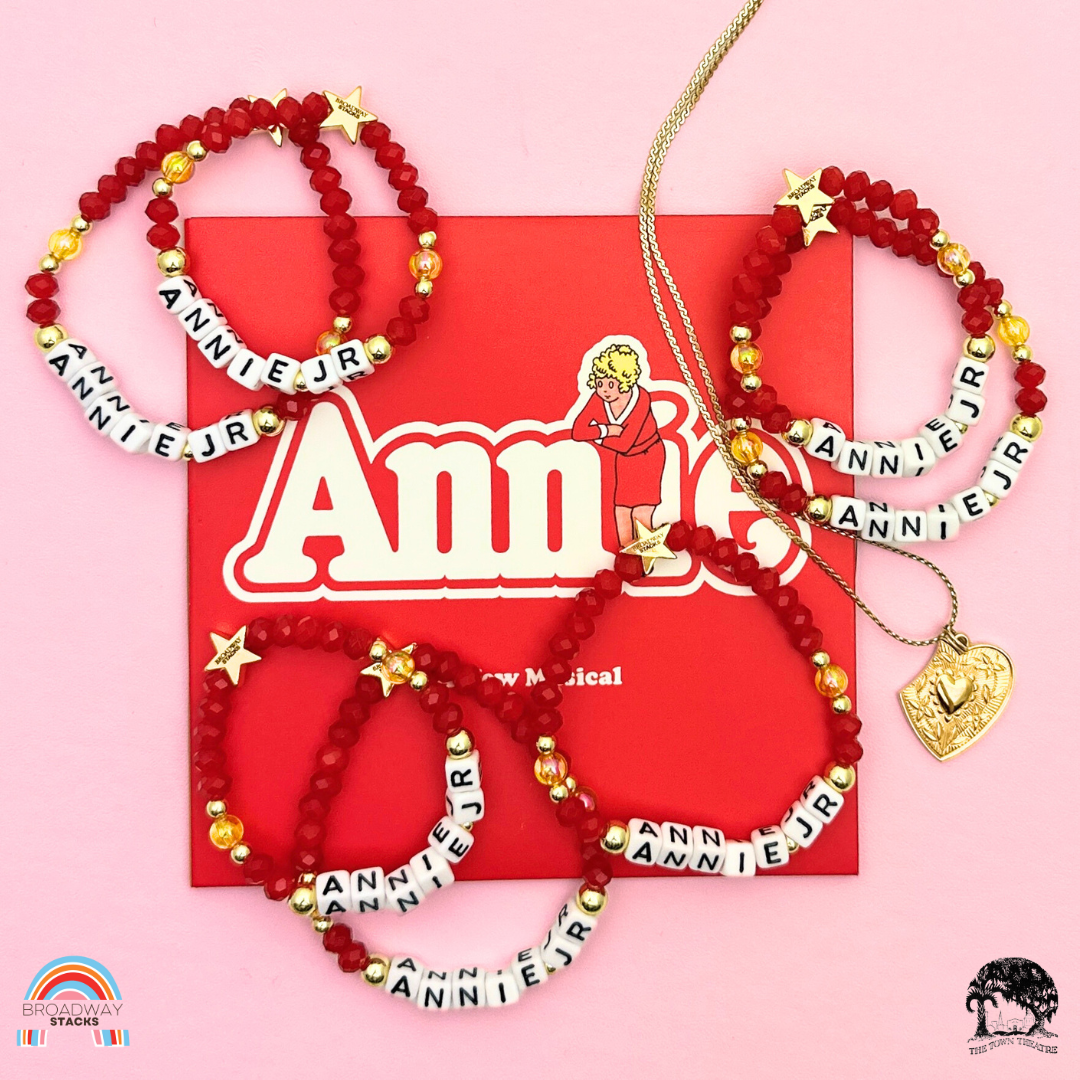 Town Theatre - Annie Jr Limited Edition Bracelet Fundraiser. 1 stretch bracelet. Red, yellow and gold colored beads. Letter beads that spell Annie Jr.