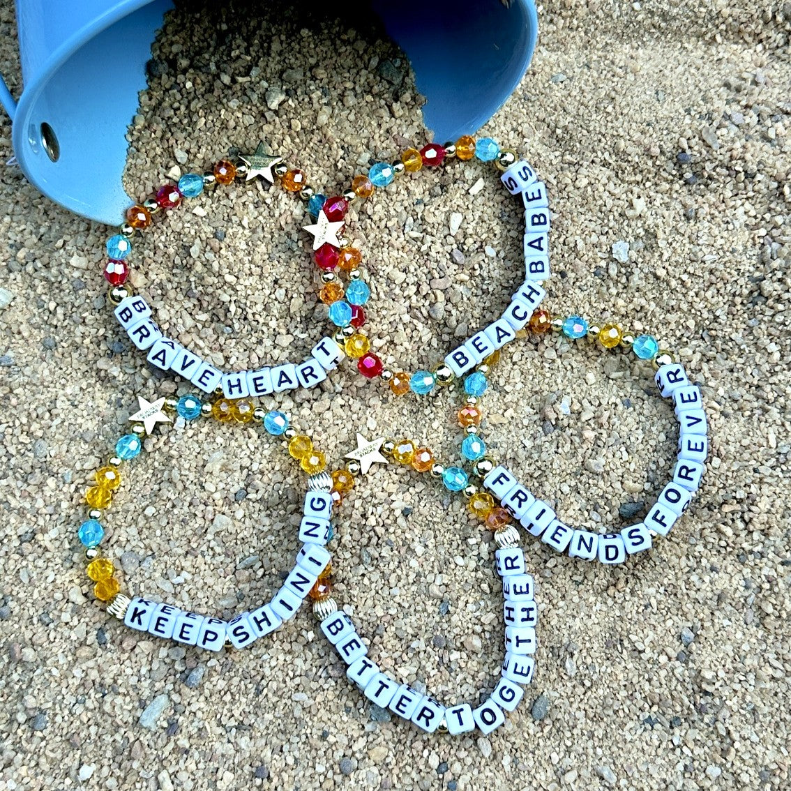 Broadway Stacks BETTER TOGETHER Collection. 5 stretch bracelets included in Stack. Black, white, red, blue, orange, yellow and gold colored beads. Letter beads that spell quotes. Star logo bead to remind you that you shine. Beaches the Musical fans.