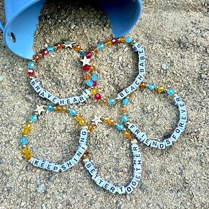 Broadway Stacks BETTER TOGETHER Collection. 5 stretch bracelets included in Stack. Black, white, red, blue, orange, yellow and gold colored beads. Letter beads that spell quotes. Star logo bead to remind you that you shine. Beaches the Musical fans.