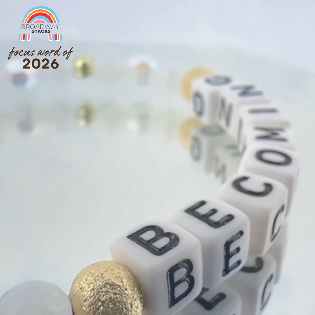 Broadway Stacks Special Edition bracelet. 2026 Focus Word of the Year.  Letter beads that spell Becoming. Based on Pantone Color of the Year Cloud Dancer. Star logo bead to remind you that you shine.