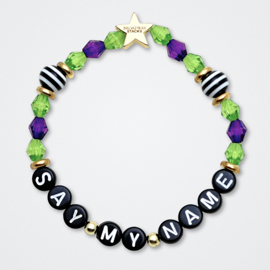 Broadway Stacks NETHERWORLD Collection. 5 stretch bracelets included in Stack. Green, black, purple, striped and gold colored beads. Letter beads that spell quotes. Gold star logo bead to remind you that You Shine. Beetlejuice fans. 