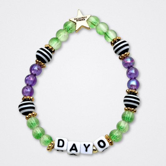 Broadway Stacks NETHERWORLD Collection. 5 stretch bracelets included in Stack. Green, black, purple, striped and gold colored beads. Letter beads that spell quotes. Gold star logo bead to remind you that You Shine. Beetlejuice fans. 