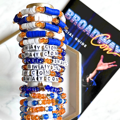 Broadway Stacks BroadwayCon 2024 Stack bracelets. 3 stretch bracelets. Blue, orange, white and gold colored beads. Letter beads that spell Bway Con. All have star logo bead.