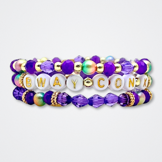 Broadway Stacks BroadwayCon X 2025 Special Edition bracelet. Stack of 3 bracelets. Purple, gold and iridescent colored beads. Letter beads that spell Bway Con X.