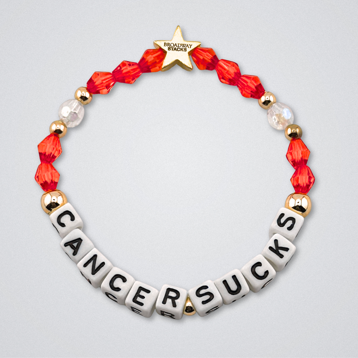 Broadway Stacks Special Edition bracelet. Red, pink, orange, yellow, green, blue. purple, white and gold beads. Letter beads that spell Cancer Sucks. Helping the Broadway Husbands and their fight with Lymphoma cancer. Star logo bead to remind you that you shine.