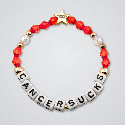 Broadway Stacks Special Edition bracelet. Red, pink, orange, yellow, green, blue. purple, white and gold beads. Letter beads that spell Cancer Sucks. Helping the Broadway Husbands and their fight with Lymphoma cancer. Star logo bead to remind you that you shine.