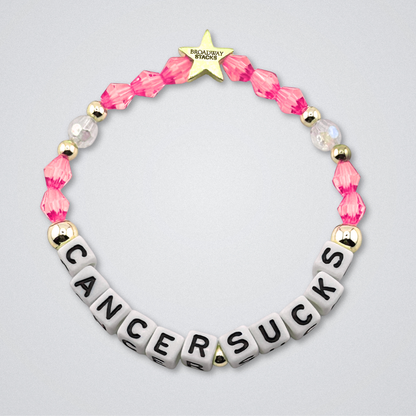 Broadway Stacks Special Edition bracelet. Red, pink, orange, yellow, green, blue. purple, white and gold beads. Letter beads that spell Cancer Sucks. Helping the Broadway Husbands and their fight with Lymphoma cancer. Star logo bead to remind you that you shine.