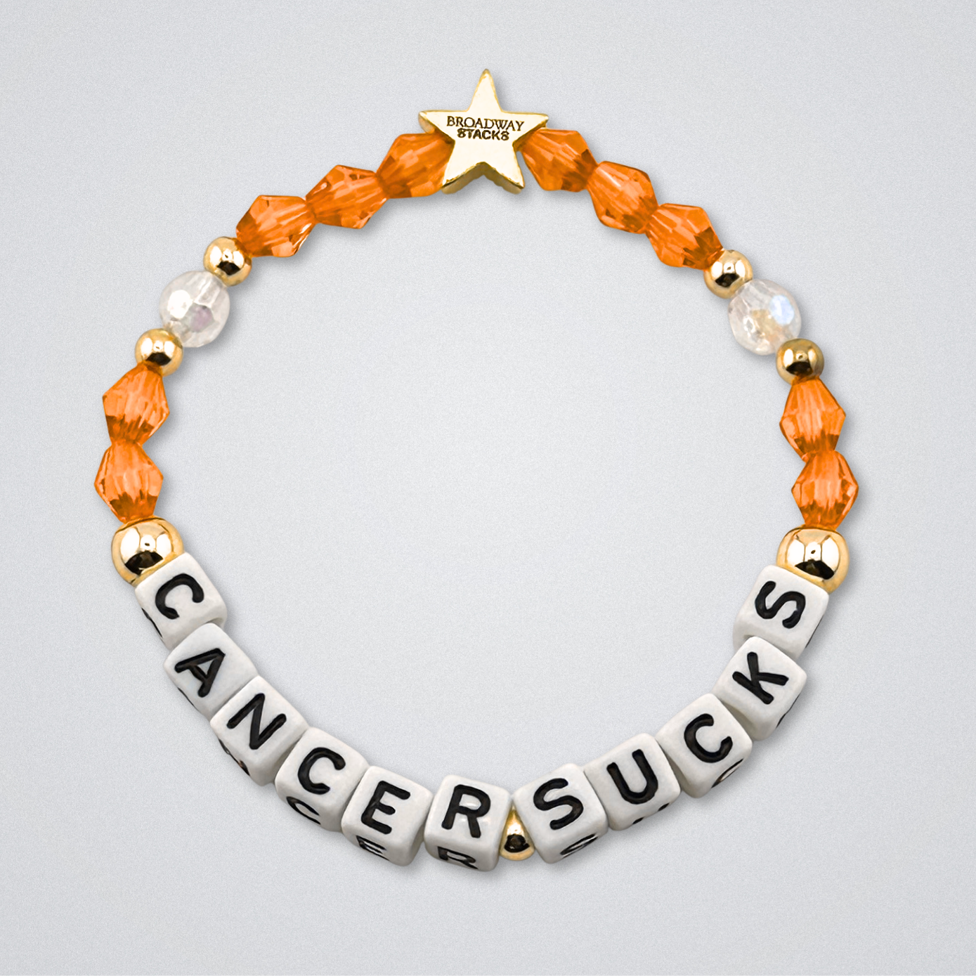 Broadway Stacks Special Edition bracelet. Red, pink, orange, yellow, green, blue. purple, white and gold beads. Letter beads that spell Cancer Sucks. Helping the Broadway Husbands and their fight with Lymphoma cancer. Star logo bead to remind you that you shine.