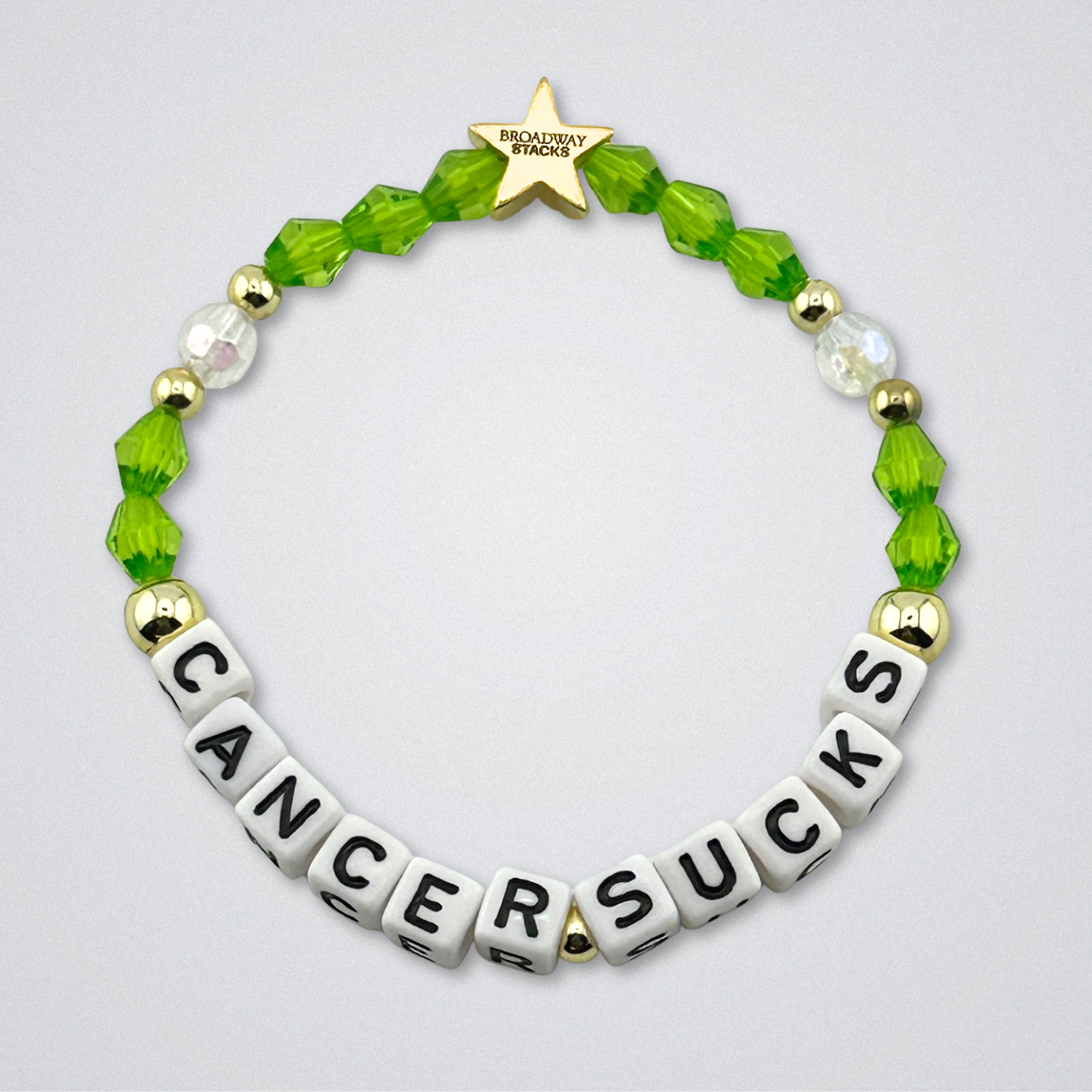 Broadway Stacks Special Edition bracelet. Red, pink, orange, yellow, green, blue. purple, white and gold beads. Letter beads that spell Cancer Sucks. Helping the Broadway Husbands and their fight with Lymphoma cancer. Star logo bead to remind you that you shine.