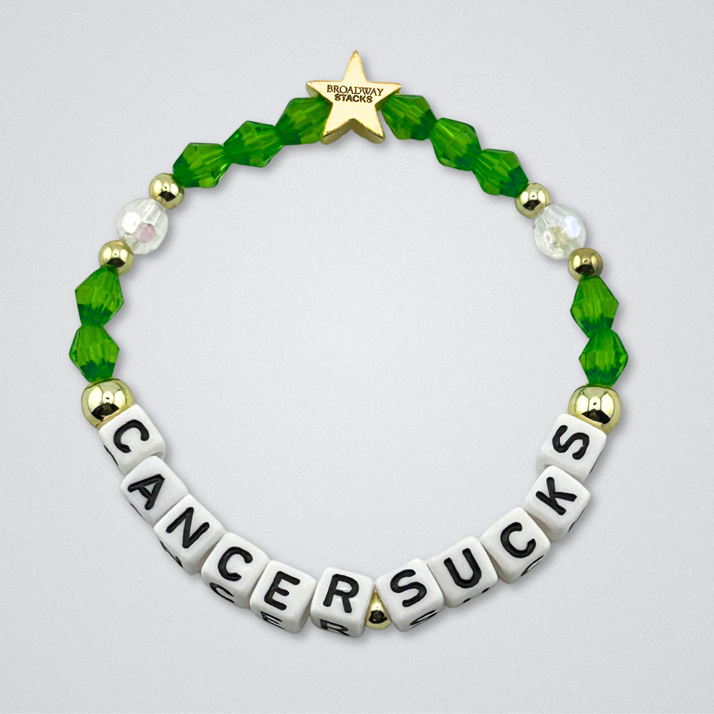 Broadway Stacks Special Edition bracelet. Red, pink, orange, yellow, green, blue. purple, white and gold beads. Letter beads that spell Cancer Sucks. Helping the Broadway Husbands and their fight with Lymphoma cancer. Star logo bead to remind you that you shine.