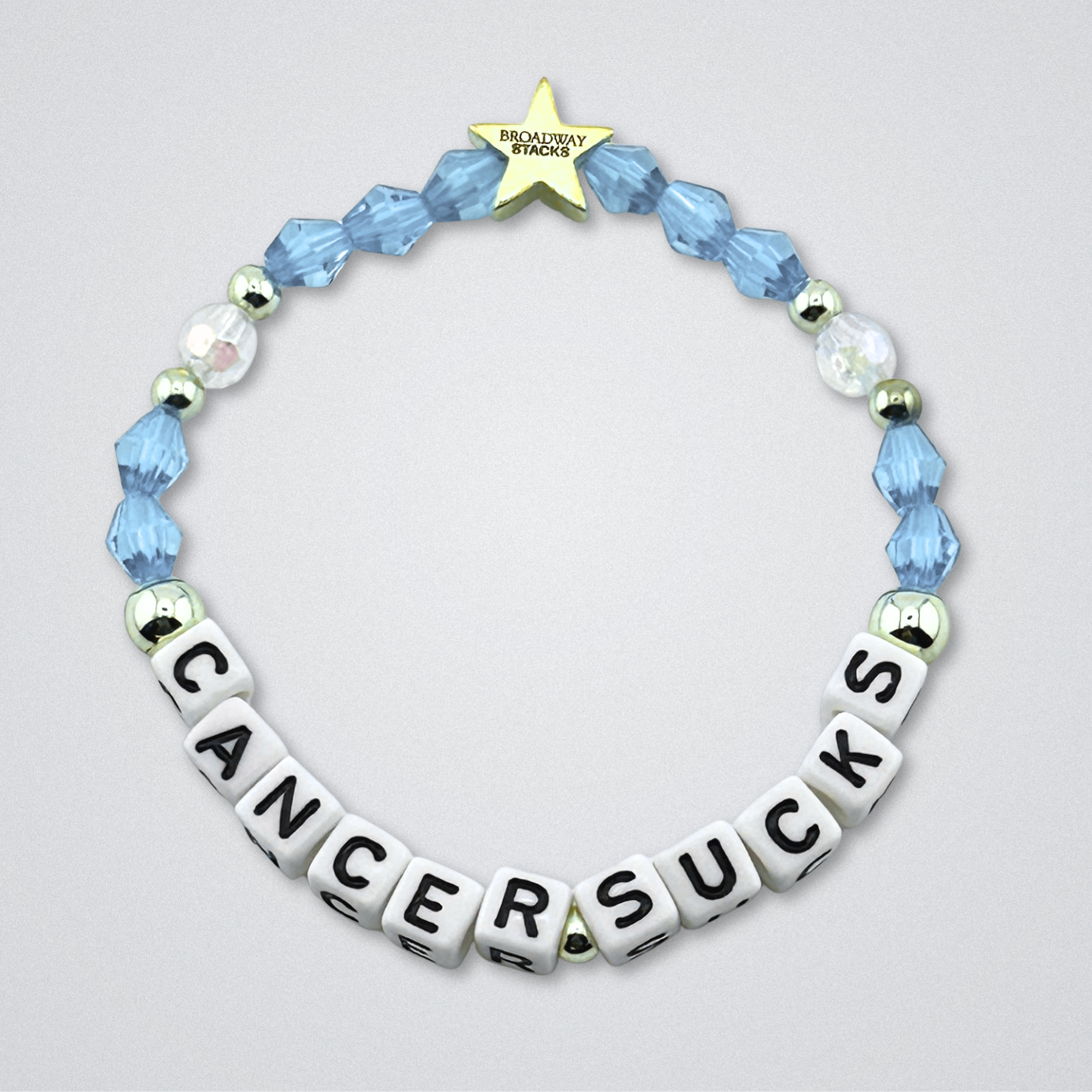 Broadway Stacks Special Edition bracelet. Red, pink, orange, yellow, green, blue. purple, white and gold beads. Letter beads that spell Cancer Sucks. Helping the Broadway Husbands and their fight with Lymphoma cancer. Star logo bead to remind you that you shine.