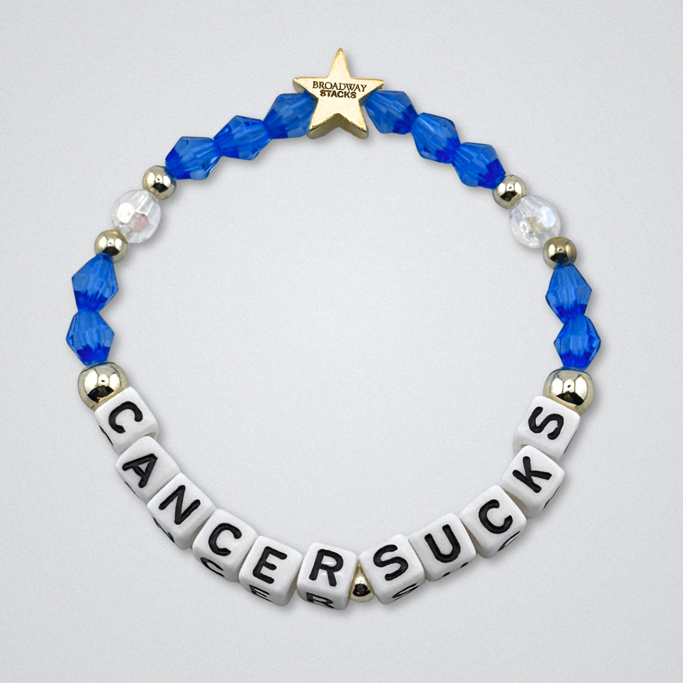 Broadway Stacks Special Edition bracelet. Red, pink, orange, yellow, green, blue. purple, white and gold beads. Letter beads that spell Cancer Sucks. Helping the Broadway Husbands and their fight with Lymphoma cancer. Star logo bead to remind you that you shine.