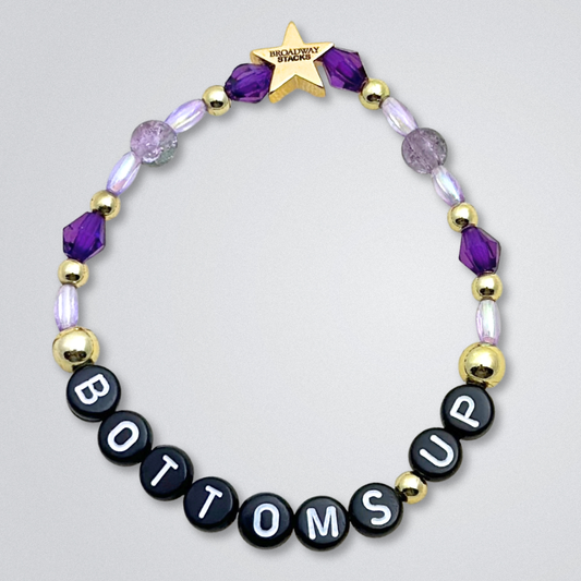 Broadway Stacks SIEMPRE VIVA Collection. 5 stretch bracelets included in Stack. Purple, blue, green, yellow, orange, red and gold colored beads. Letter beads that spell quotes. Gold star logo bead to remind you that you shine. Death Becomes Her fans.
