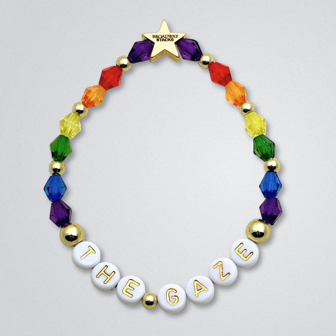 Broadway Stacks SIEMPRE VIVA Collection. 5 stretch bracelets included in Stack. Purple, blue, green, yellow, orange, red and gold colored beads. Letter beads that spell quotes. Gold star logo bead to remind you that you shine. Death Becomes Her fans. The Gaze.