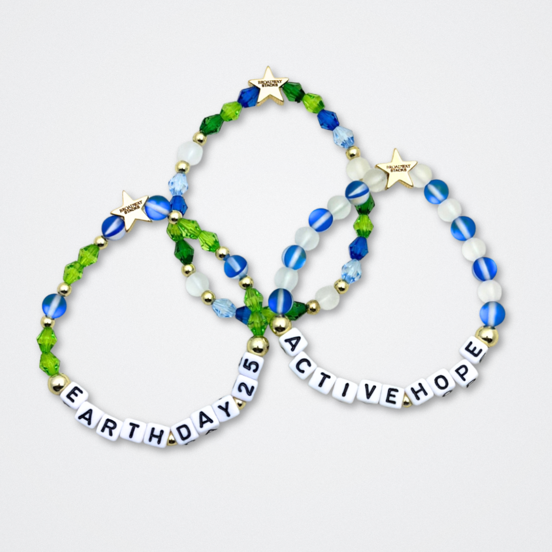 Earth Day Special Edition bracelet. Stack of 3 bracelets. Green, blue, white and gold beads. Letter beads that spell Earth Day 25 and Active Hope. Gold star logo bead to remind you that You Shine.