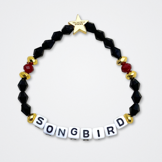 Broadway Stacks UNDERWORLD collection. 5 stretch bracelets included in Stack. Red, garnet, black and gold colored beads. Letter beads that spell quotes. Gold star logo bead to remind you that you shine. Hadestown fans.