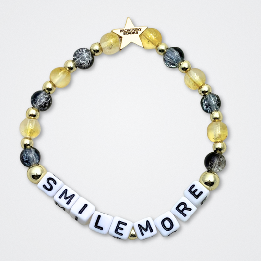 Broadway Stacks REVOLUTION Collection. 5 stretch bracelets included in Stack. Yellow, white, black and gold colored beads. Letter beads that spell quotes. Gold star logo bead to remind you that You Shine. Hamilton the Musical fans. 