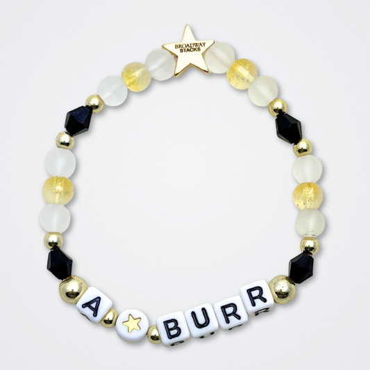 Broadway Stacks REVOLUTION Collection. 5 stretch bracelets included in Stack. Yellow, white, black and gold colored beads. Letter beads that spell quotes. Gold star logo bead to remind you that You Shine. Hamilton the Musical fans. 
