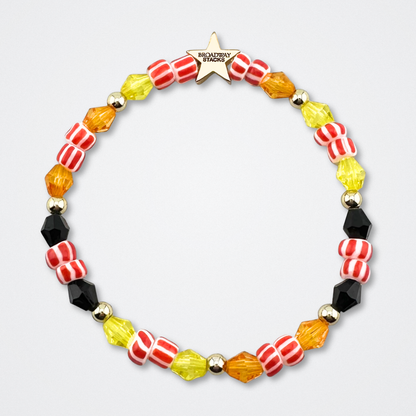 Broadway Stacks SAFARI collection.Yellow, orange, black, animal print and gold colored beads on bracelet on gray background. Star logo bead to remind you that YOU SHINE! The Lion King and theatre fans.