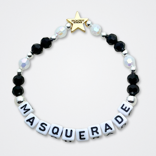Broadway Stacks MASQUERADE Collection. 4 stretch bracelets included in Stack. Black, white and silver colored beads. Letter beads that spell quotes. Gold star logo bead to remind you that you shine. Phantom of the Opera and Masquerade NYC fans.