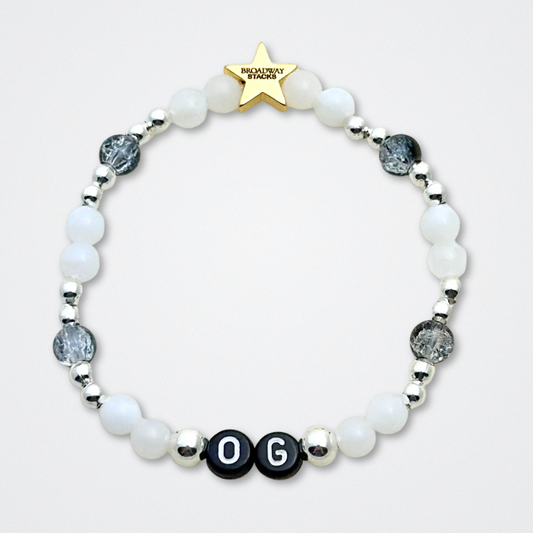 Broadway Stacks MASQUERADE Collection. 4 stretch bracelets included in Stack. Black, white and silver colored beads. Letter beads that spell quotes. Gold star logo bead to remind you that you shine. Phantom of the Opera and Masquerade NYC fans.