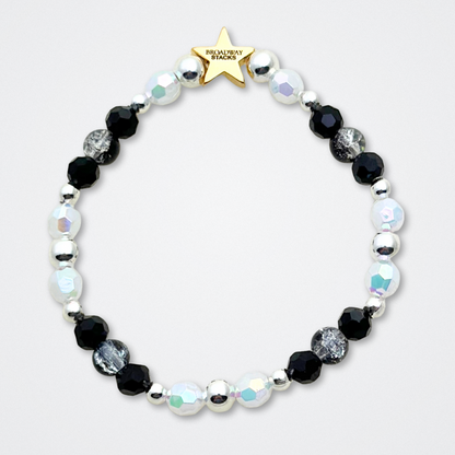 Broadway Stacks MASQUERADE Collection. 4 stretch bracelets included in Stack. Black, white and silver colored beads. Letter beads that spell quotes. Gold star logo bead to remind you that you shine. Phantom of the Opera and Masquerade NYC fans.