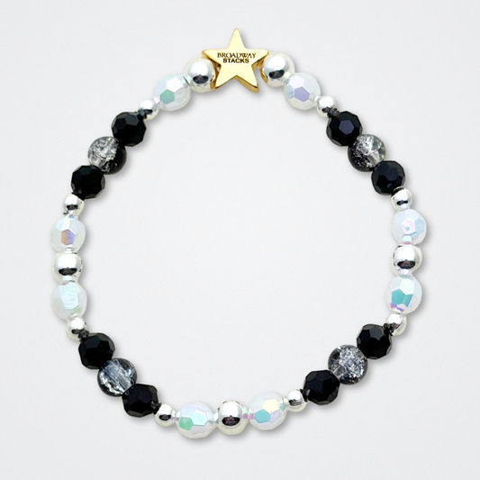 Broadway Stacks MASQUERADE Collection. 4 stretch bracelets included in Stack. Black, white and silver colored beads. Letter beads that spell quotes. Gold star logo bead to remind you that you shine. Phantom of the Opera and Masquerade NYC fans.