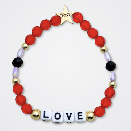 Broadway Stacks RED LIGHT Collection. 5 stretch bracelets included in Stack. Red, purple, black and gold colored beads. Letter beads that spell quotes. Gold star logo bead to remind you that You Shine. Moulin Rouge fans. 