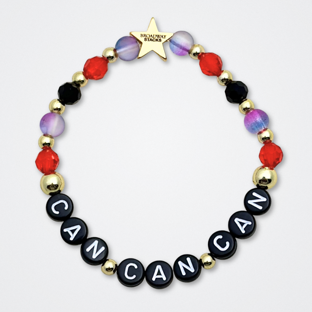 Broadway Stacks RED LIGHT Collection. 5 stretch bracelets included in Stack. Red, purple, black and gold colored beads. Letter beads that spell quotes. Gold star logo bead to remind you that You Shine. Moulin Rouge fans. 
