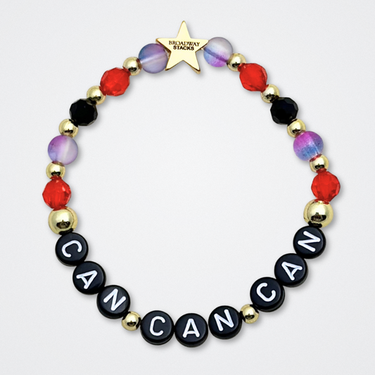 Broadway Stacks RED LIGHT Collection. 5 stretch bracelets included in Stack. Red, purple, black and gold colored beads. Letter beads that spell quotes. Gold star logo bead to remind you that You Shine. Moulin Rouge fans. 
