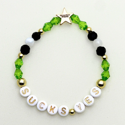 Broadway Stacks NETHERWORLD Collection. 5 stretch bracelets included in Stack. Green, black, purple, striped and gold colored beads. Letter beads that spell quotes. Gold star logo bead to remind you that you shine. Beetlejuice fans. 