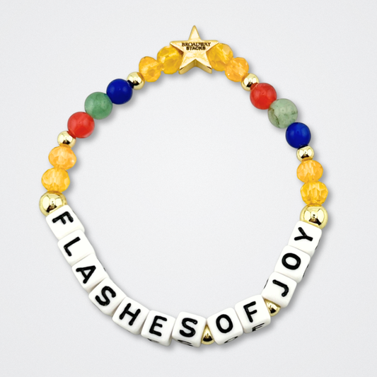 Broadway Stacks CONFIDENTIAL Collection. Flashes of Joy bracelet with red, blue, green, yellow and gold colored beads. Letter beads that spell quote. Star logo bead to remind you that you shine. Operation Mincemeat fans.