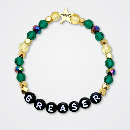 Broadway Stacks STAY GOLD collection. Stretch bracelets included in Stack. Gold, yellow, green and grey colored beads. Letter beads that have show quote or name. Broadway Stacks gold star logo bead to remind you that You Shine. The Outsiders the Musical fans.