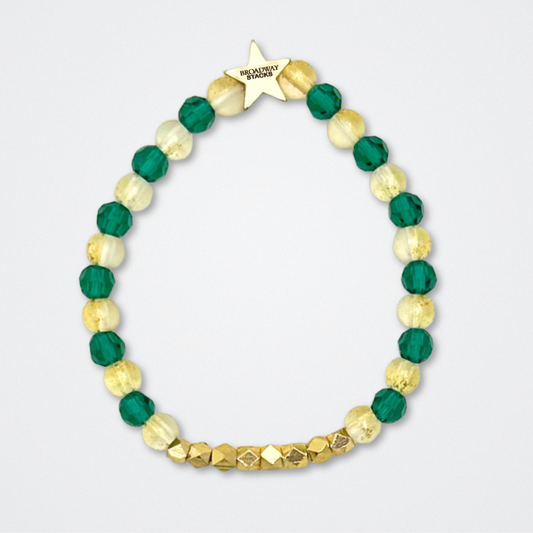 Broadway Stacks STAY GOLD collection. Stretch bracelets included in Stack. Gold, yellow, green and grey colored beads. Letter beads that have show quote or name. Broadway Stacks gold star logo bead to remind you that You Shine. The Outsiders the Musical fans.