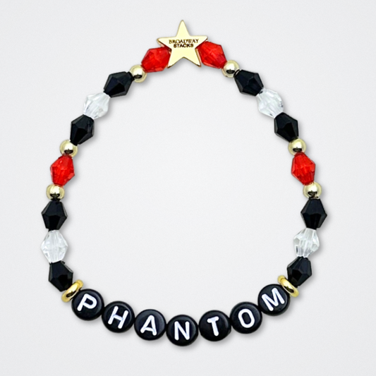 Broadway Stacks MASK collection. Bead bracelets included in Stack. Red, black, white and gold colored beads. Letter beads that spell quotes. Team Phantom, Team Christine, Team Raoul. Gold star logo bead to remind you that You Shine. Phantom of the Opera and Masquerade fans.