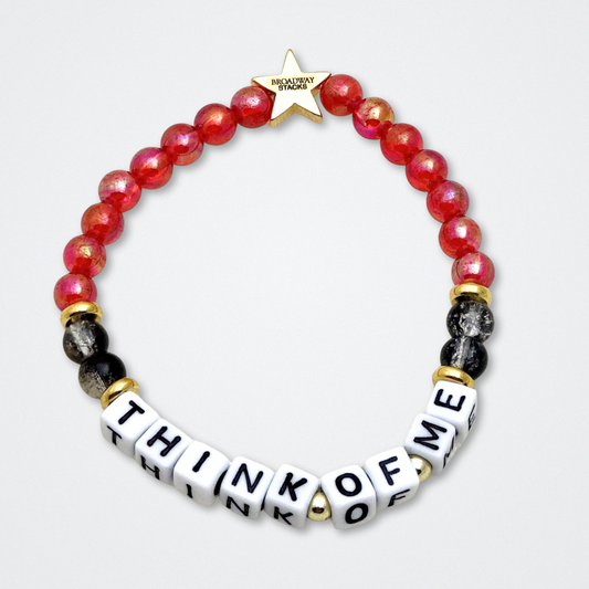 Broadway Stacks MASK collection. Bead bracelets included in Stack. Red, black, white and gold colored beads. Letter beads that spell quotes. Team Phantom, Team Christine, Team Raoul. Gold star logo bead to remind you that You Shine. Phantom of the Opera and Masquerade fans.