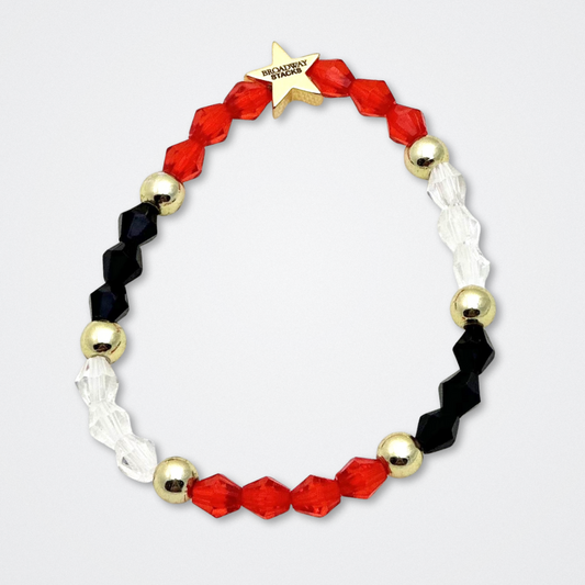 Broadway Stacks MASK collection. Bead bracelets included in Stack. Red, black, white and gold colored beads. Letter beads that spell quotes. Team Phantom, Team Christine, Team Raoul. Gold star logo bead to remind you that You Shine. Phantom of the Opera and Masquerade fans.