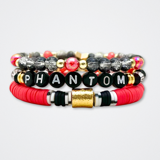 Broadway Stacks MASK collection. Bead bracelets included in Stack. Red, black, white and gold colored beads. Letter beads that spell quotes. Team Phantom, Team Christine, Team Raoul. Gold star logo bead to remind you that You Shine. Phantom of the Opera and Masquerade fans.