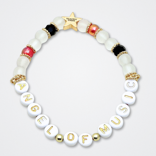 Broadway Stacks MASK collection. Bead bracelets included in Stack. Red, black, white and gold colored beads. Letter beads that spell quotes. Team Phantom, Team Christine, Team Raoul. Gold star logo bead to remind you that You Shine. Phantom of the Opera and Masquerade fans.
