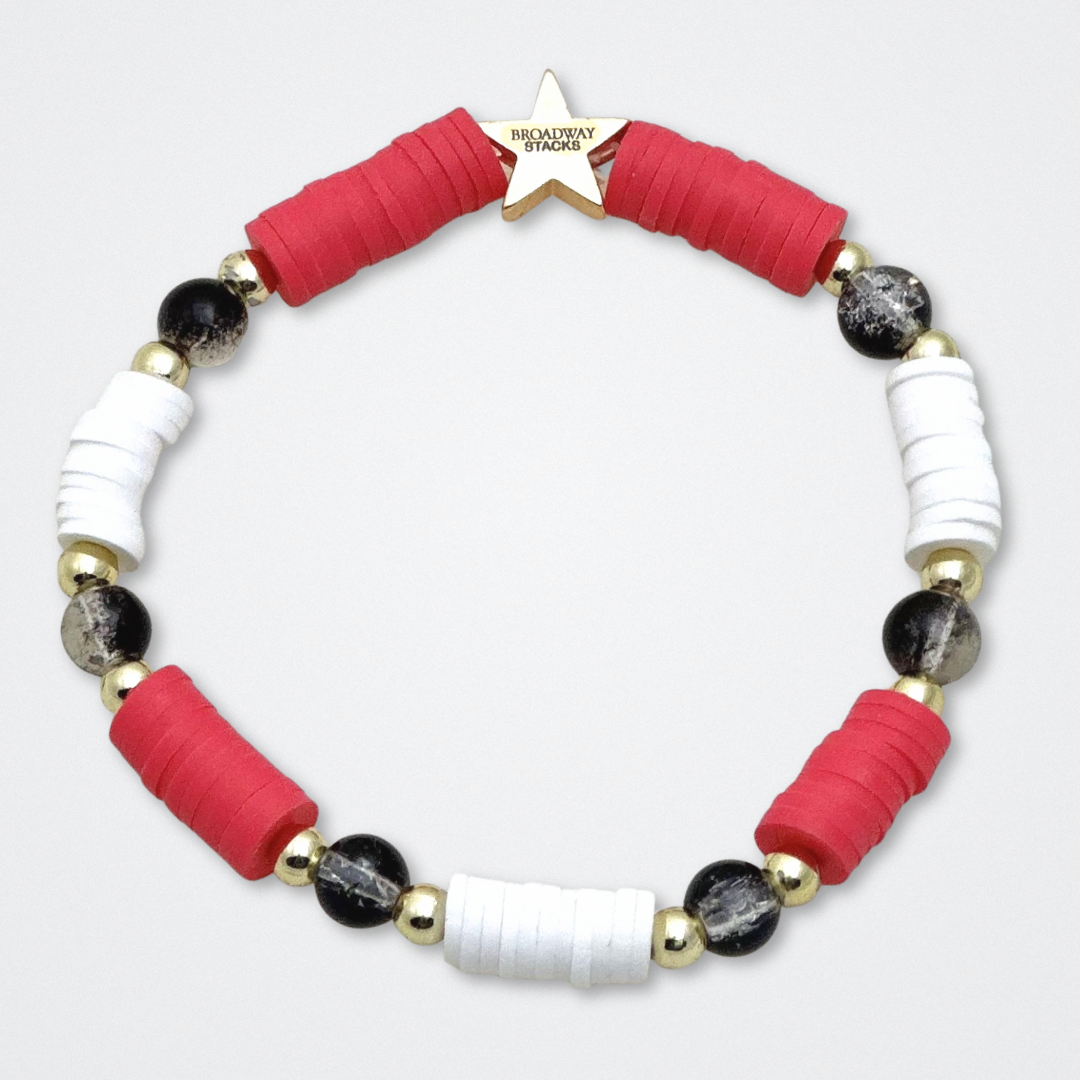 Broadway Stacks MASK collection. Bead bracelets included in Stack. Red, black, white and gold colored beads. Letter beads that spell quotes. Team Phantom, Team Christine, Team Raoul. Gold star logo bead to remind you that You Shine. Phantom of the Opera and Masquerade fans.