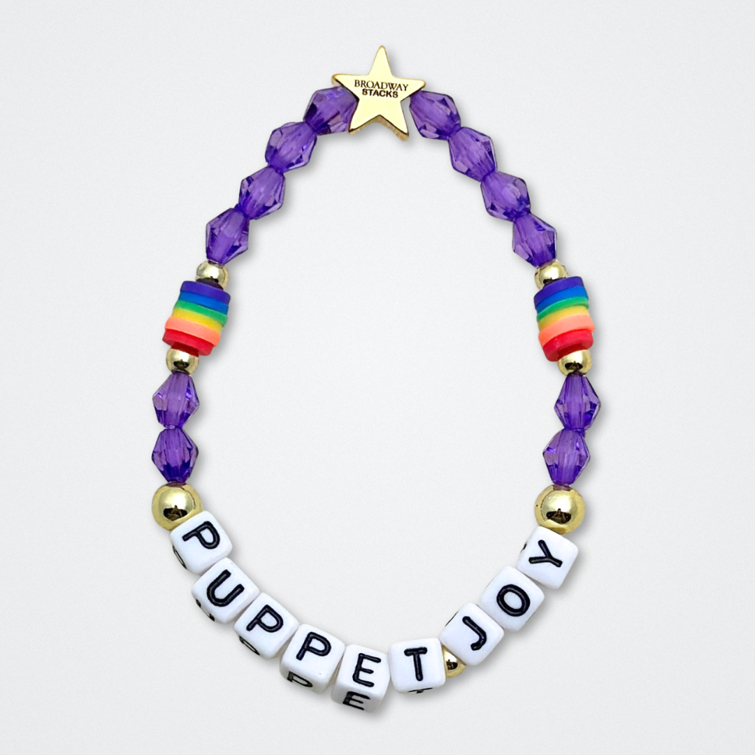 Broadway Stacks PUPPETRY Collection Special Edition bracelet. Stack of 3 bracelets. Rainbow and gold beads. Letter beads that spell Puppeteer and Puppet Joy. Gold star logo bead to remind you that You Shine. 